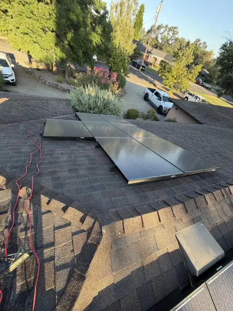 Rooftop solar panels hazy with dust, before cleaning